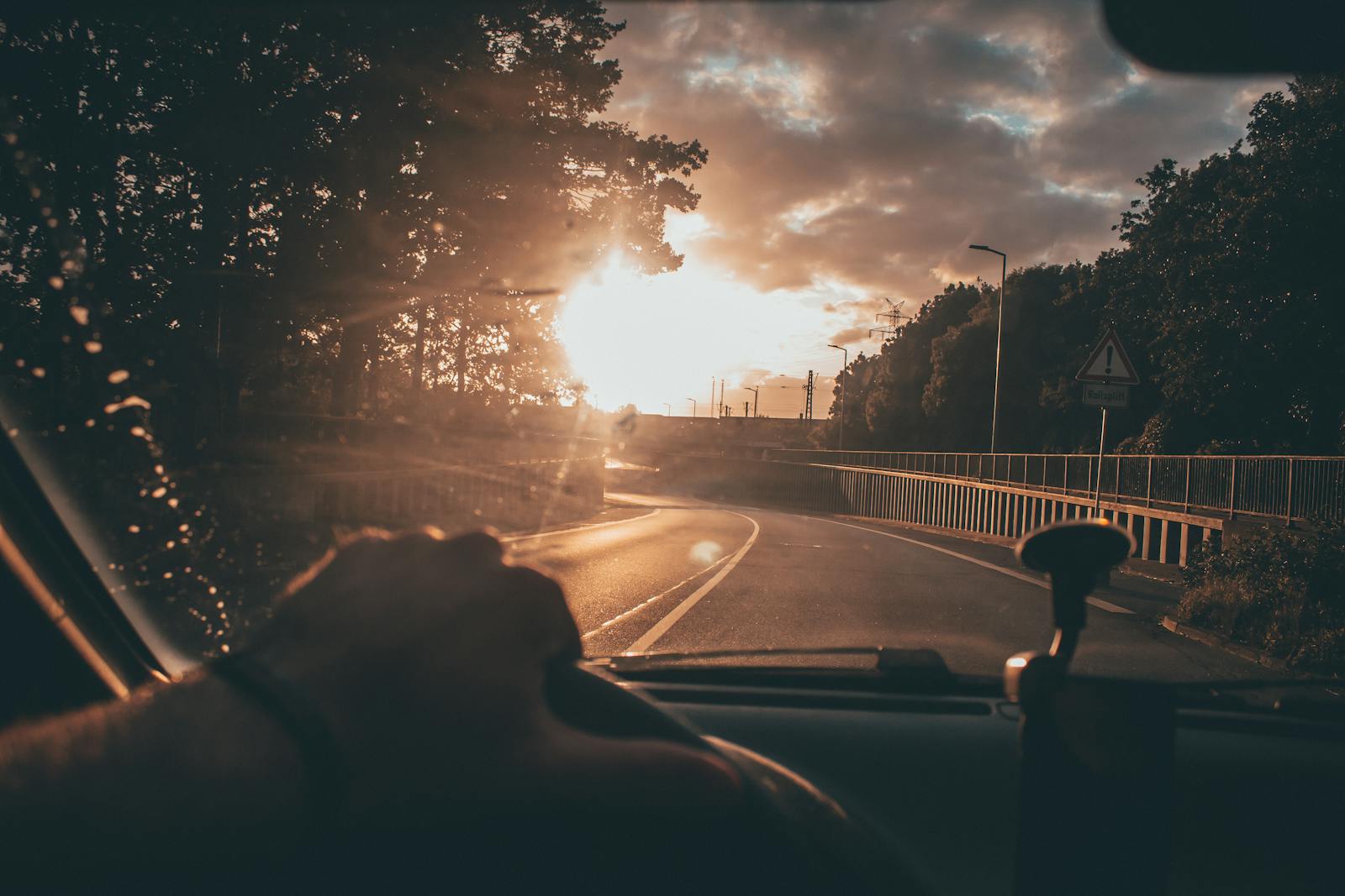 sr-22, auto, Capturing a serene drive at sunset, with a scenic road and vibrant sky.